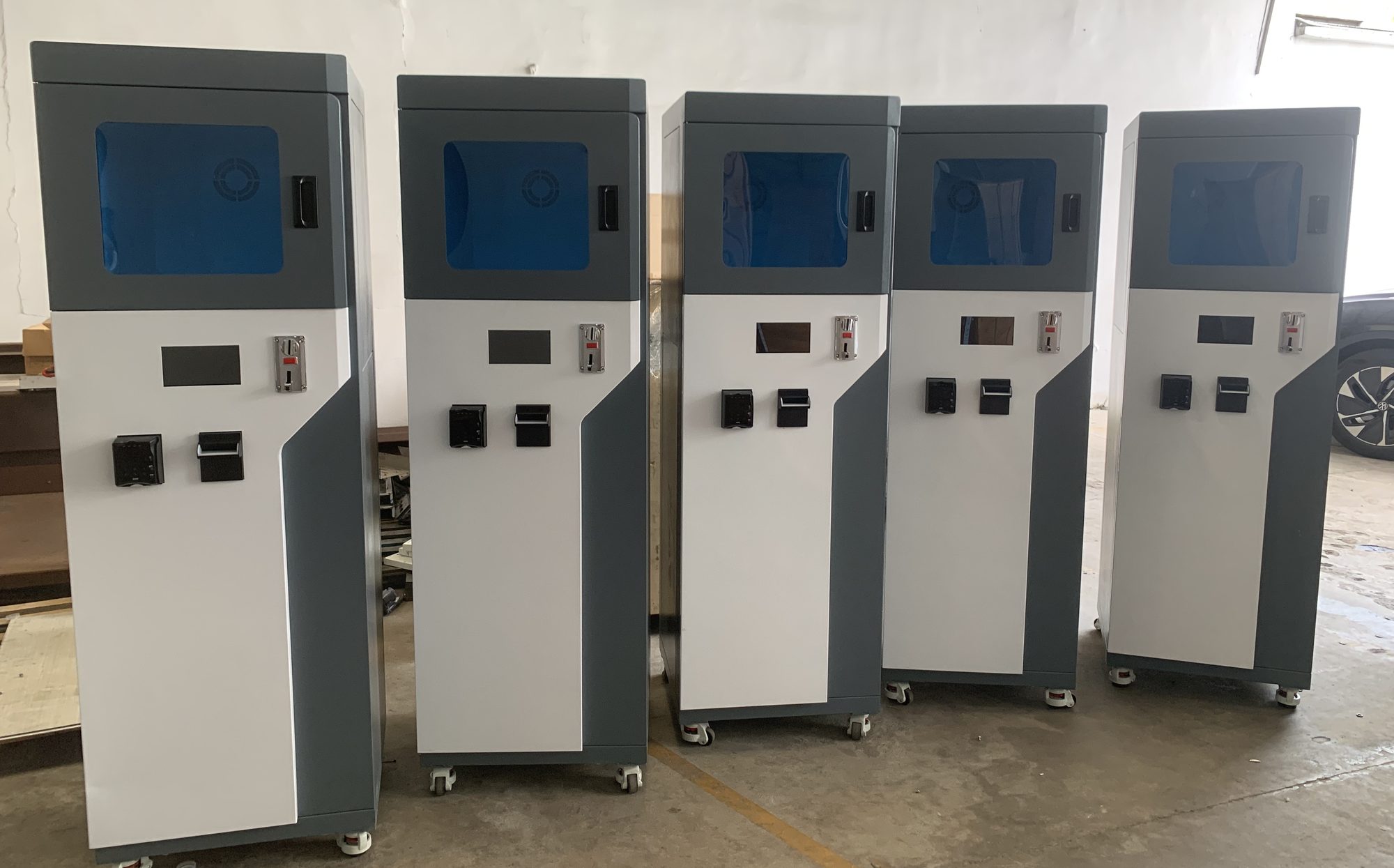 Five finished Max03 machines lined up after assembly